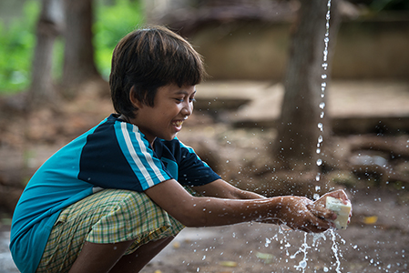 Child in Cebu, Philippines using Soap For Hope soap for handwashing